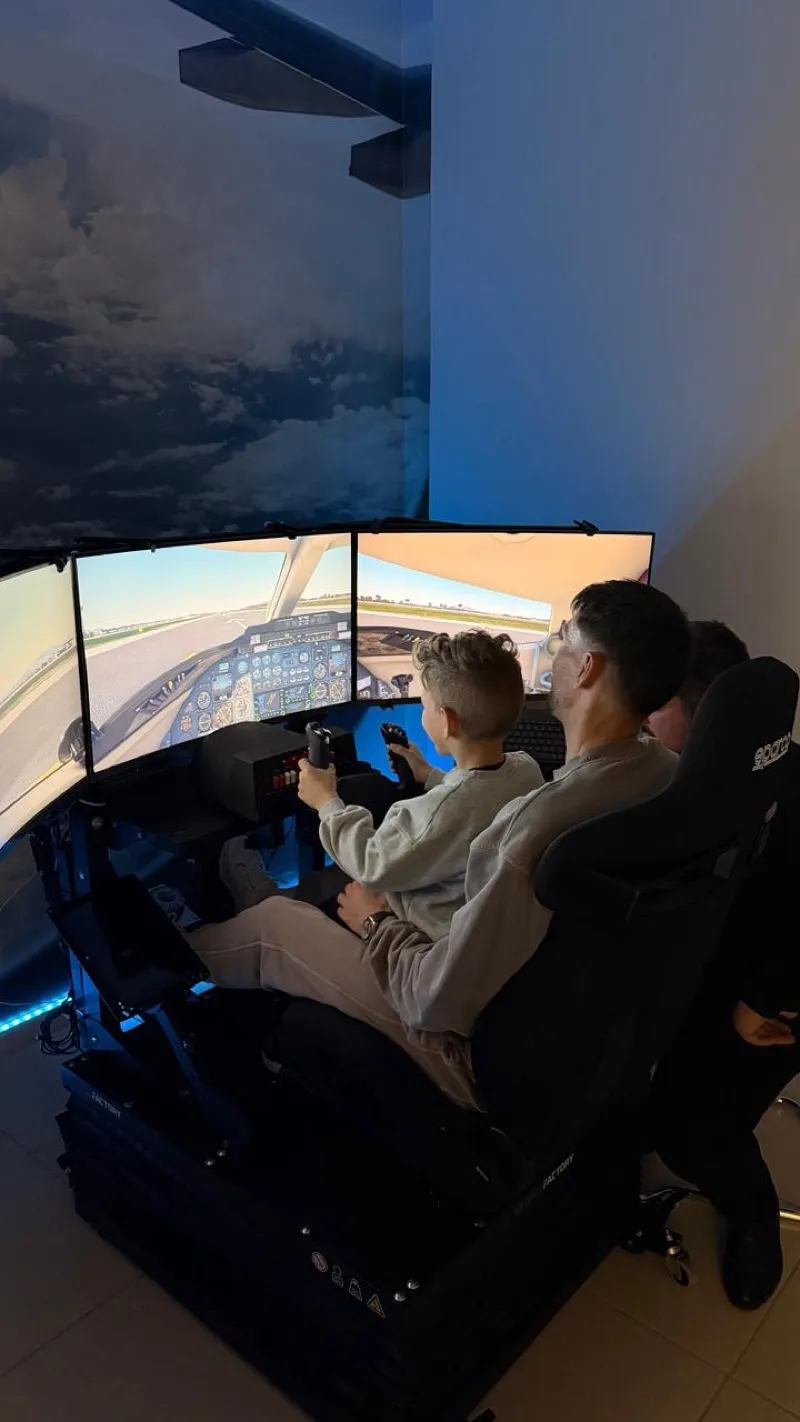 Father and son flying the Edge6D simulator together