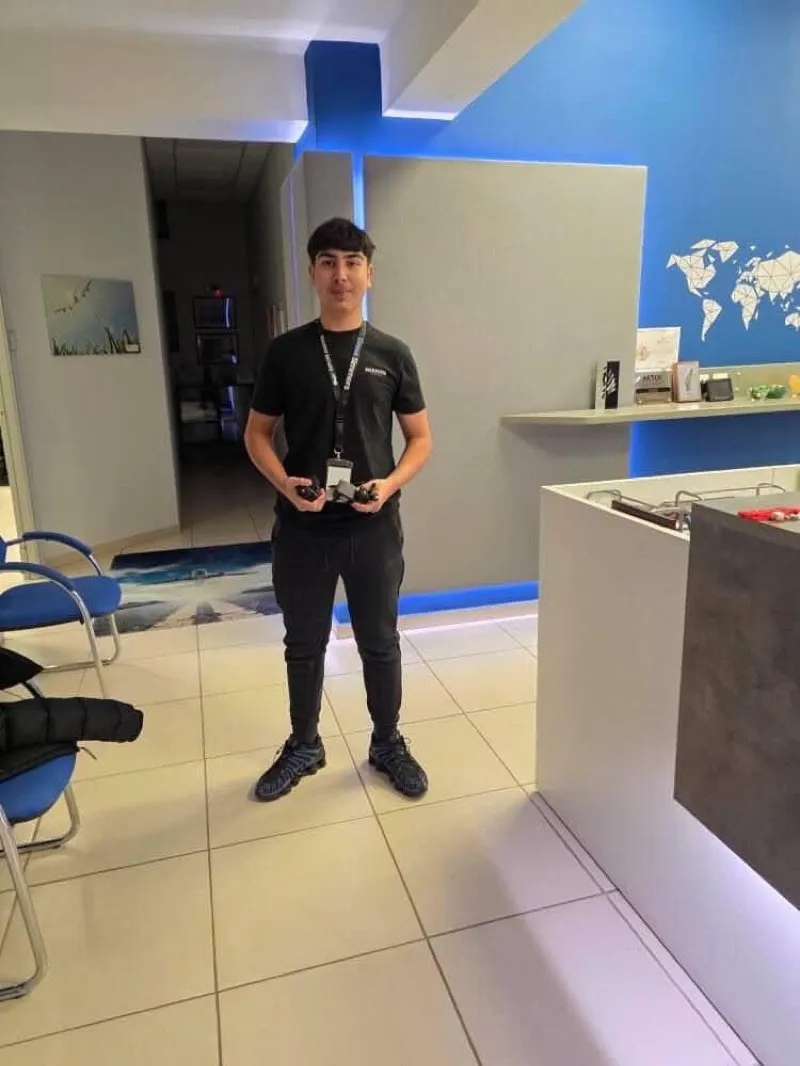 GreekSimmers staff member in the lobby welcoming visitors