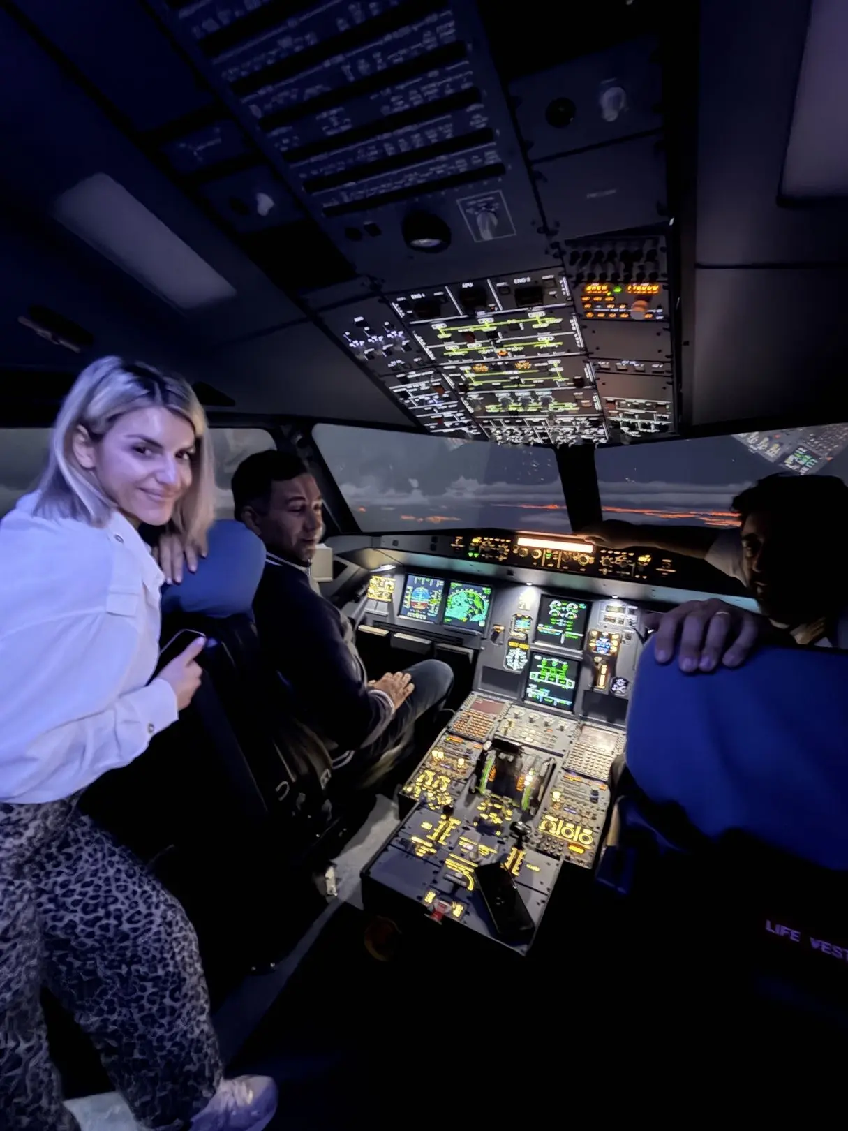 Happy couple in the cockpit after their flight experience